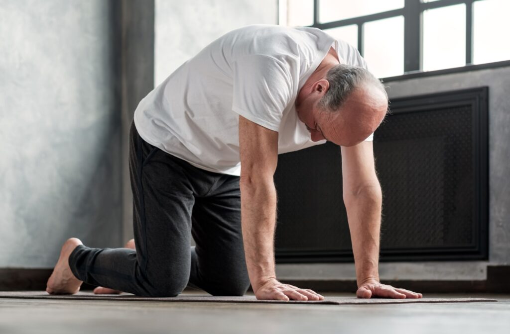 A senior performs the tabletop yoga pose.